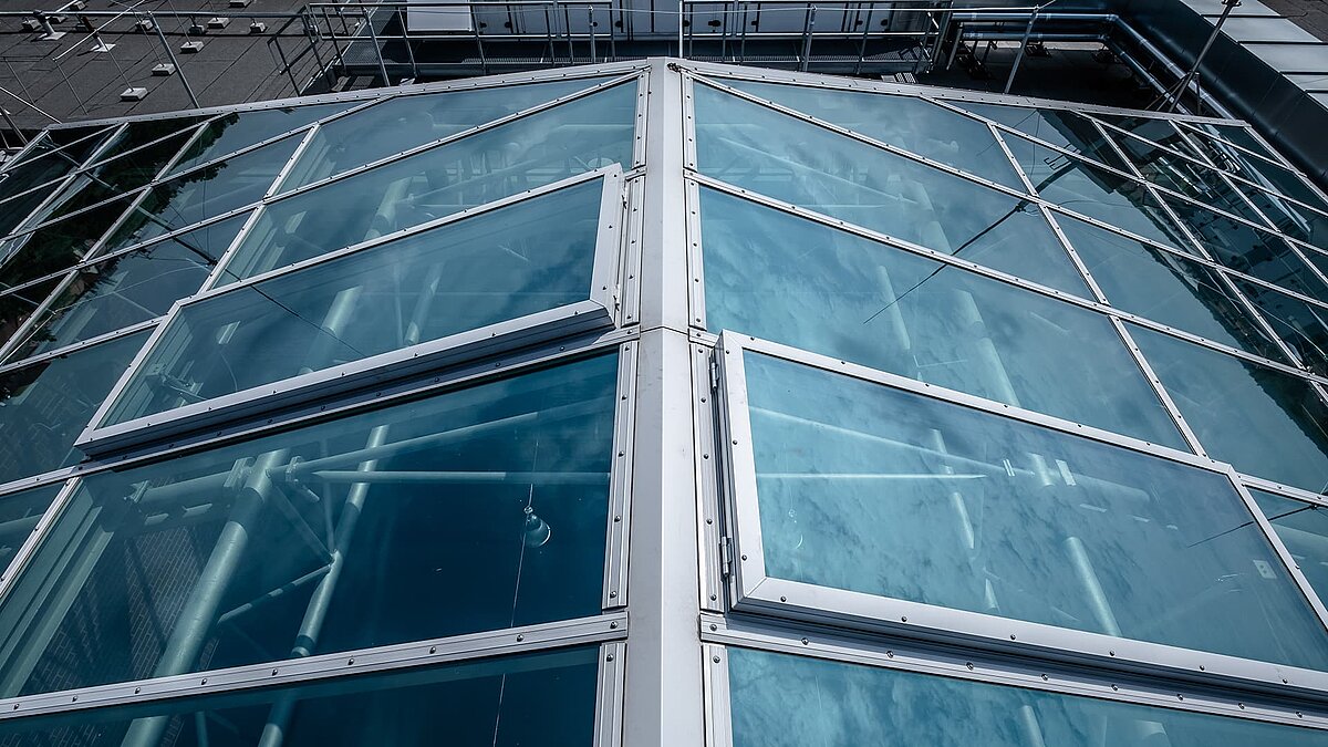 Close-up view of the glass roof at Dante-Gymnasium with steel frames.