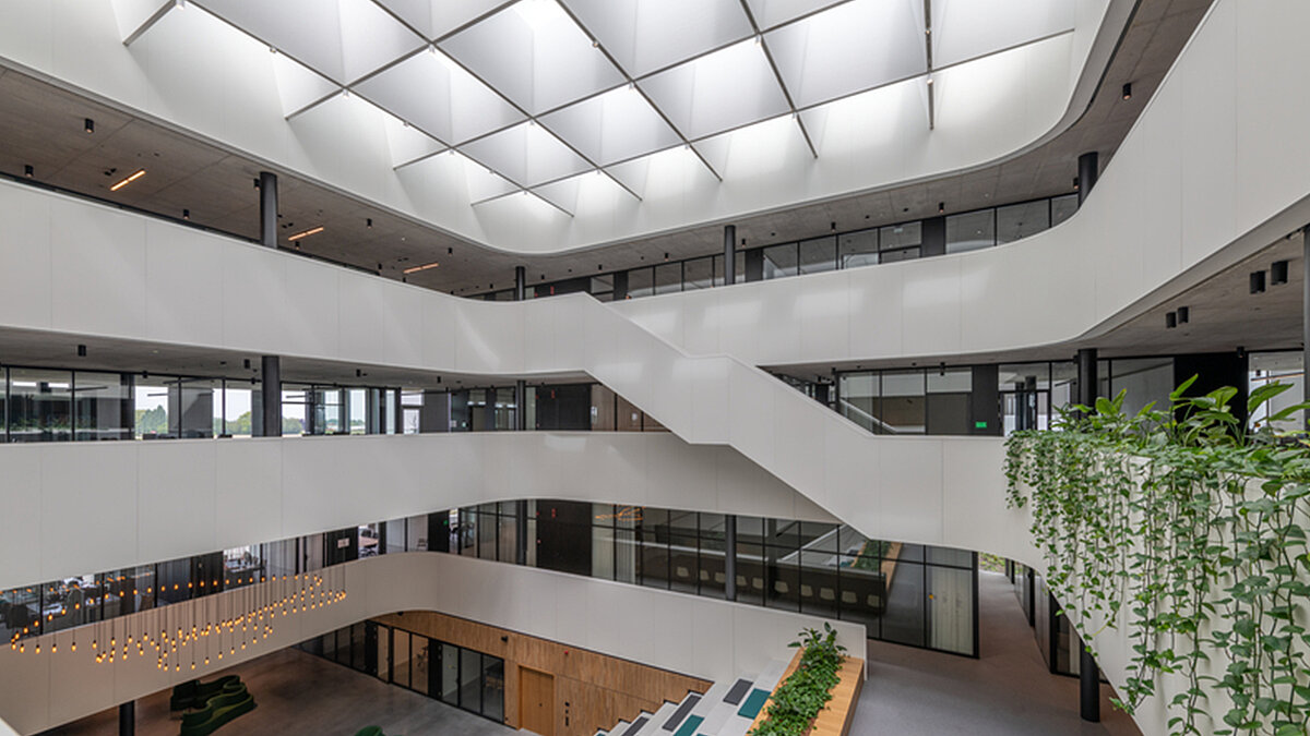 expansive glass roof with LAMILUX Glass Skylights FE 3° in modern atrium with surrounding galleries
