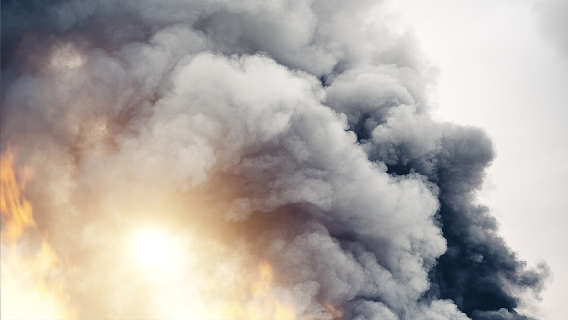Black grey fire smoke rises