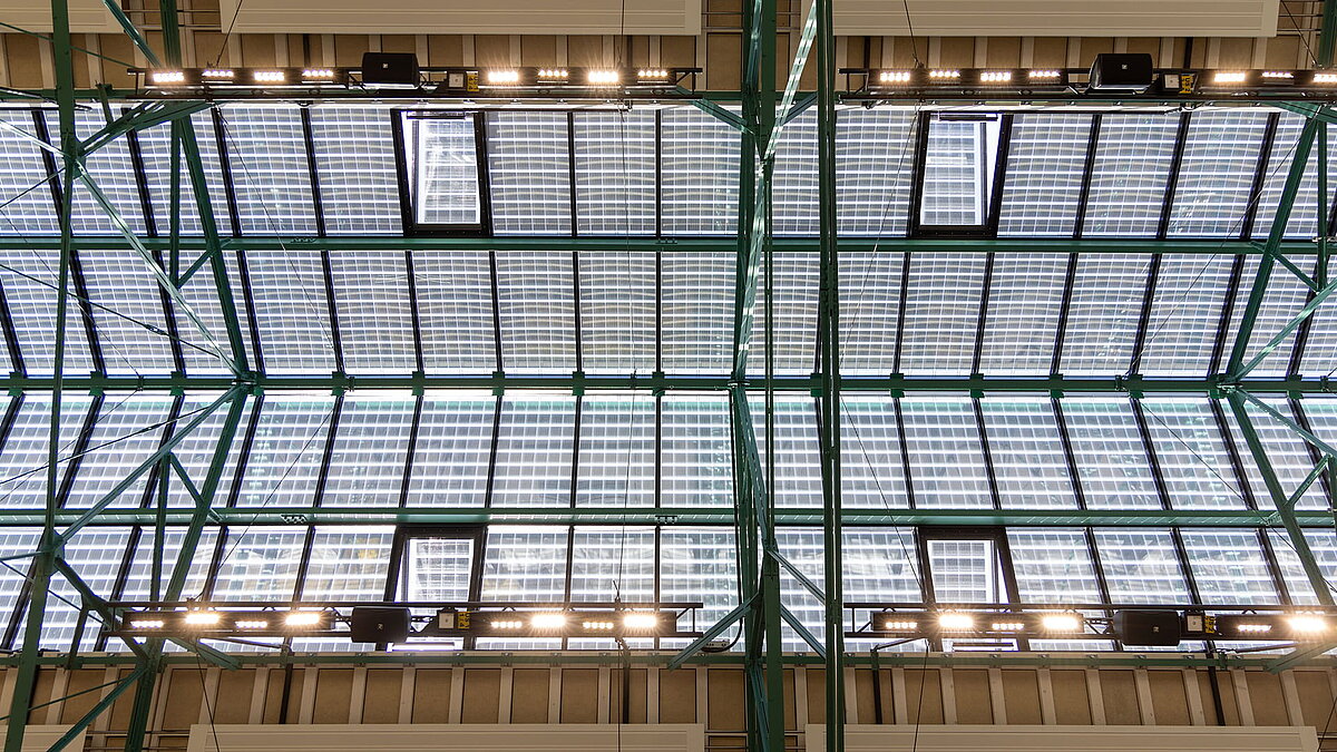 LAMILUX PR60 glass roof with integrated photovoltaic elements in steel support structure.