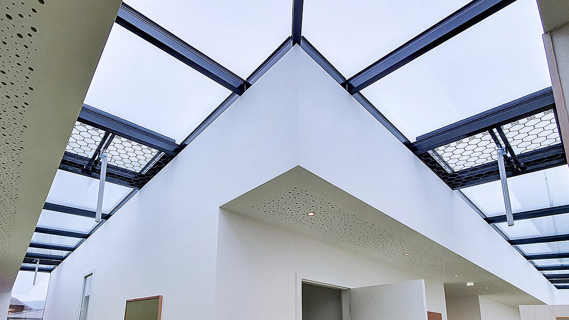 Glass roof built around the corner in a hallway