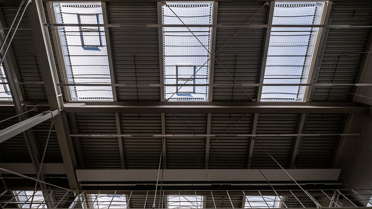 Ceiling view of the Hamburg State Opera's storage facility with rectangular skylights for natural lighting.