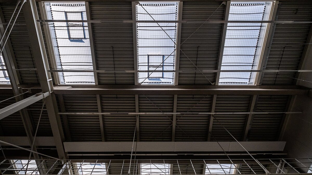 Ceiling view of the Hamburg State Opera's storage facility with rectangular skylights for natural lighting.