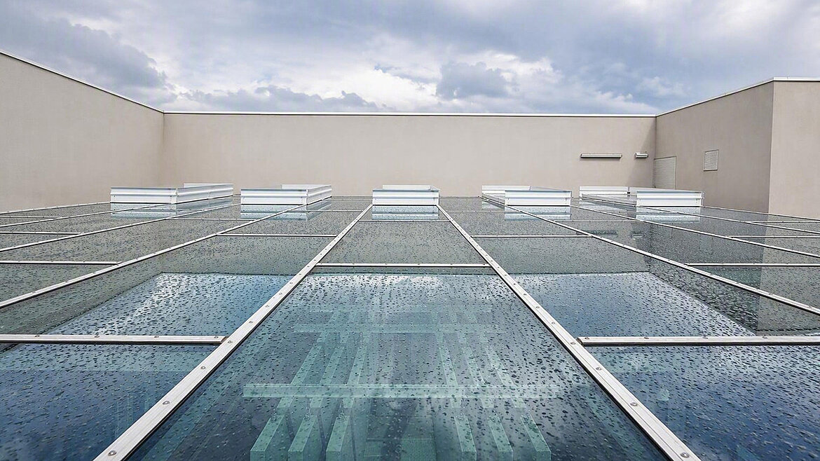 Glass roof with skylights on a cloudy day