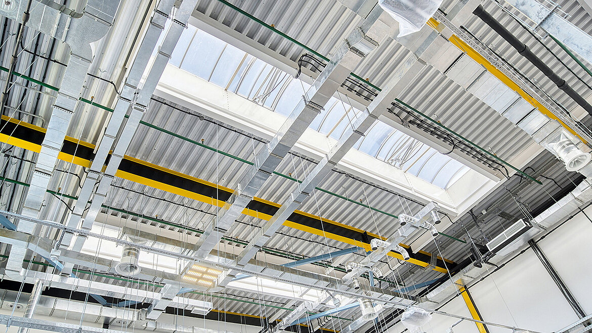 Industrial hall with continuous rooflights for extensive natural daylight illumination