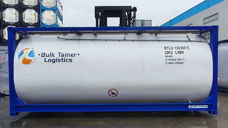White ISO tank container labeled "Bulk Tainer Logistics" with GRP tank cladding
