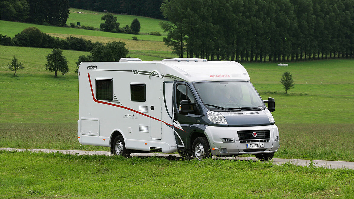 Semi-integrated motorhome Semi-integrated motorhome in a green landscape