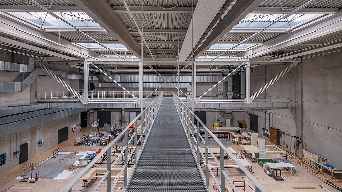 Interior view of Hamburg opera storage with LAMILUX B rooflight and stage construction workshop.