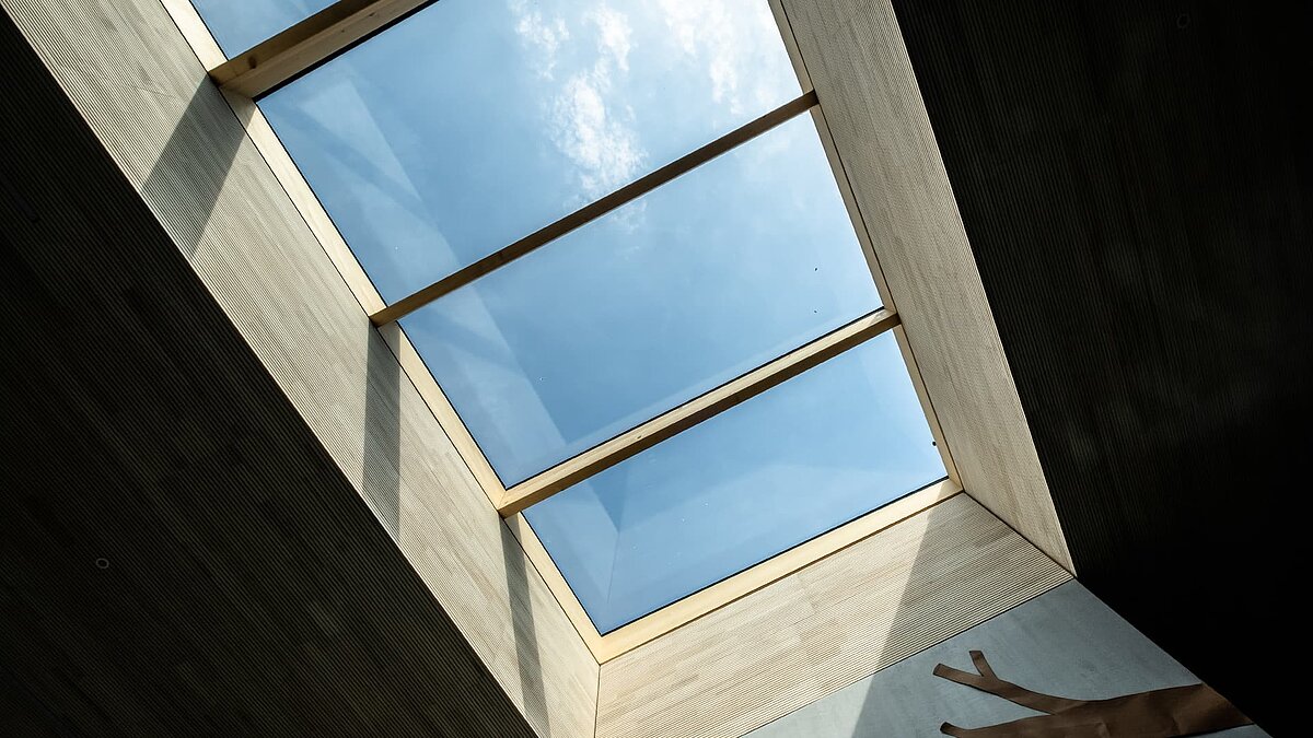 Large glass skylight in the Wiggensbach daycare center for natural light entry.