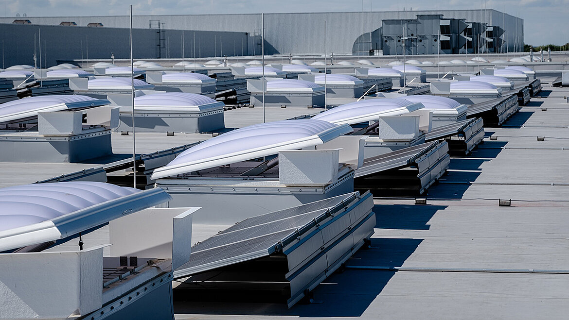 Flat roof with skylights and solar panels on an industrial building