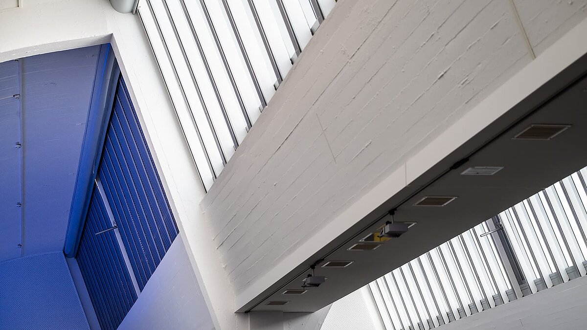 Interior view of the Vogel Convention Center in Würzburg featuring LAMILUX flat roof windows and modern architecture.