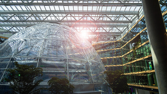 EUREF Campus Düsseldorf with modern glass architecture and sunlight in the courtyard