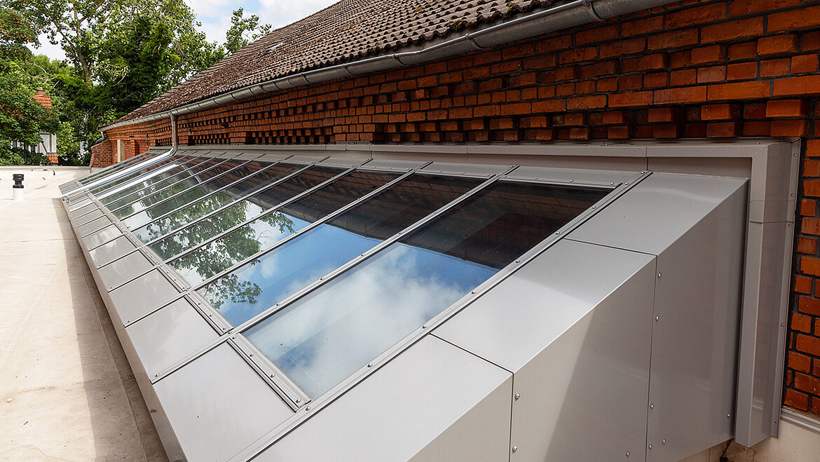 LAMILUX Glass Skylight Fire Resistance REI 30 as inclined glass solution on brick façade