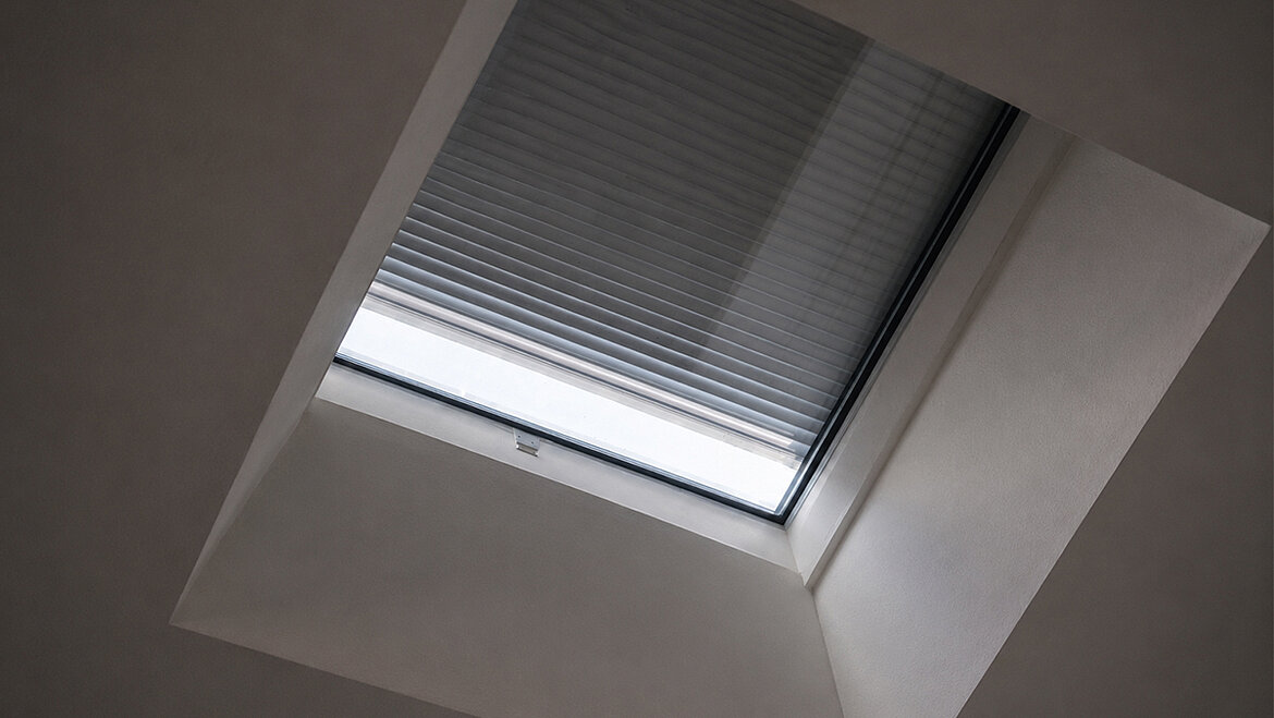LAMILUX flat roof window with closed internal sun shading