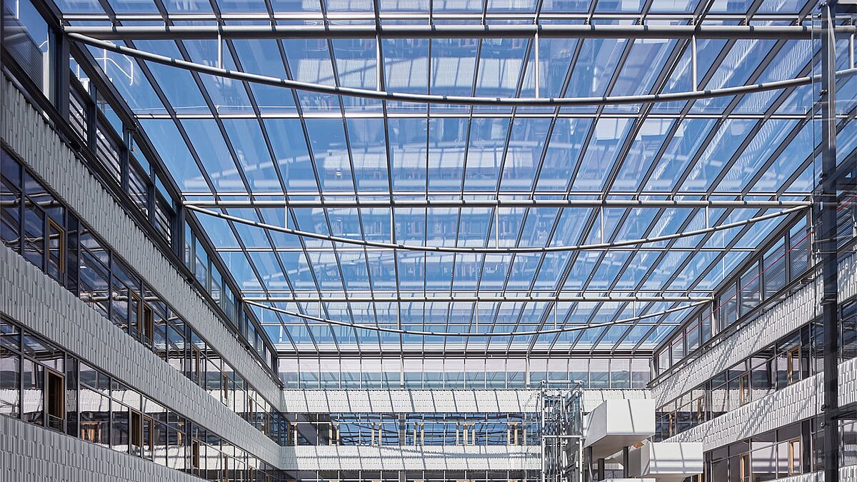 Glass roof structure in the Luxembourg Post building featuring modern steel framing and light-filled architecture.