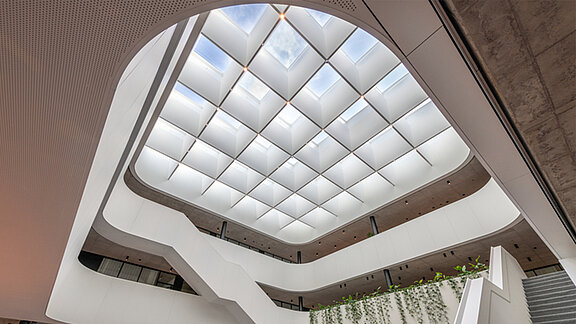 LAMILUX Glass Skylight FE 3° in atrium with upward view of large roof skylight