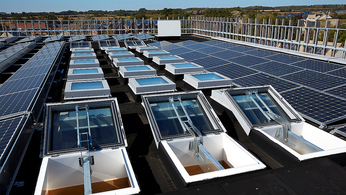 Large industrial roof with numerous flat roof windows