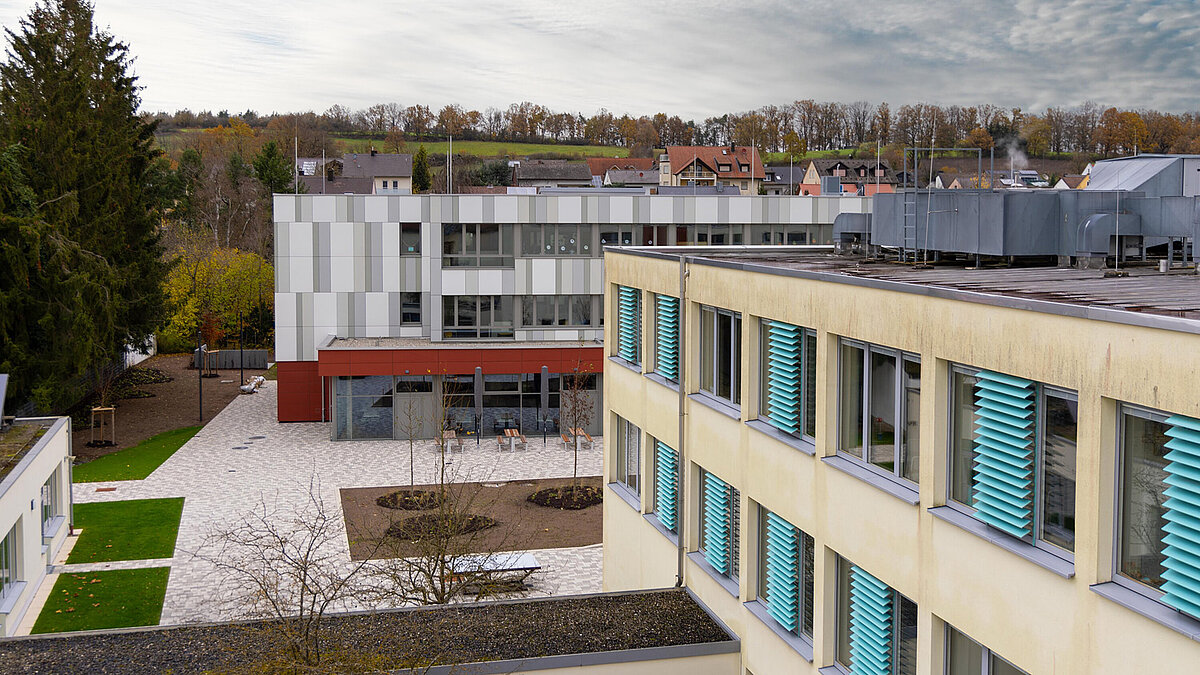 Exterior view of Burgebrach school center with LAMILUX glass roof PR60.