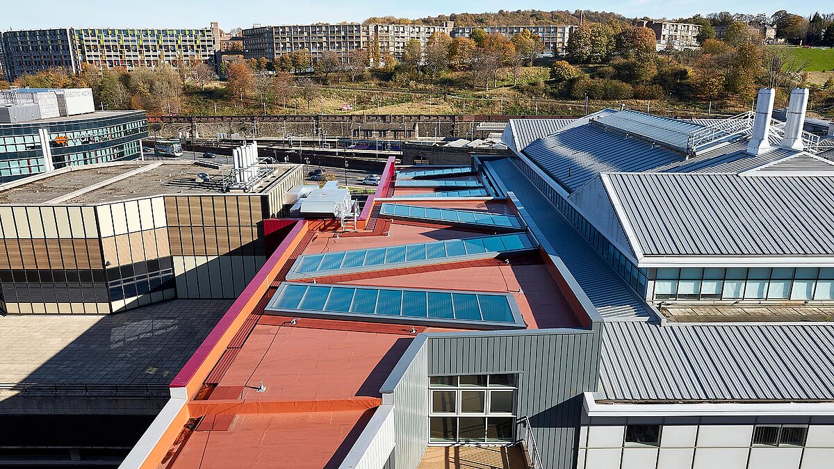 Rooftop view of Sheffield Hallam University featuring LAMILUX PR60 glass roof and modern architectural elements.