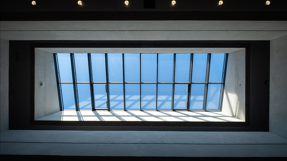 Skylights at Bertha-von-Suttner Realschule in Cologne, allowing natural daylight through a modern glass roof structure.
