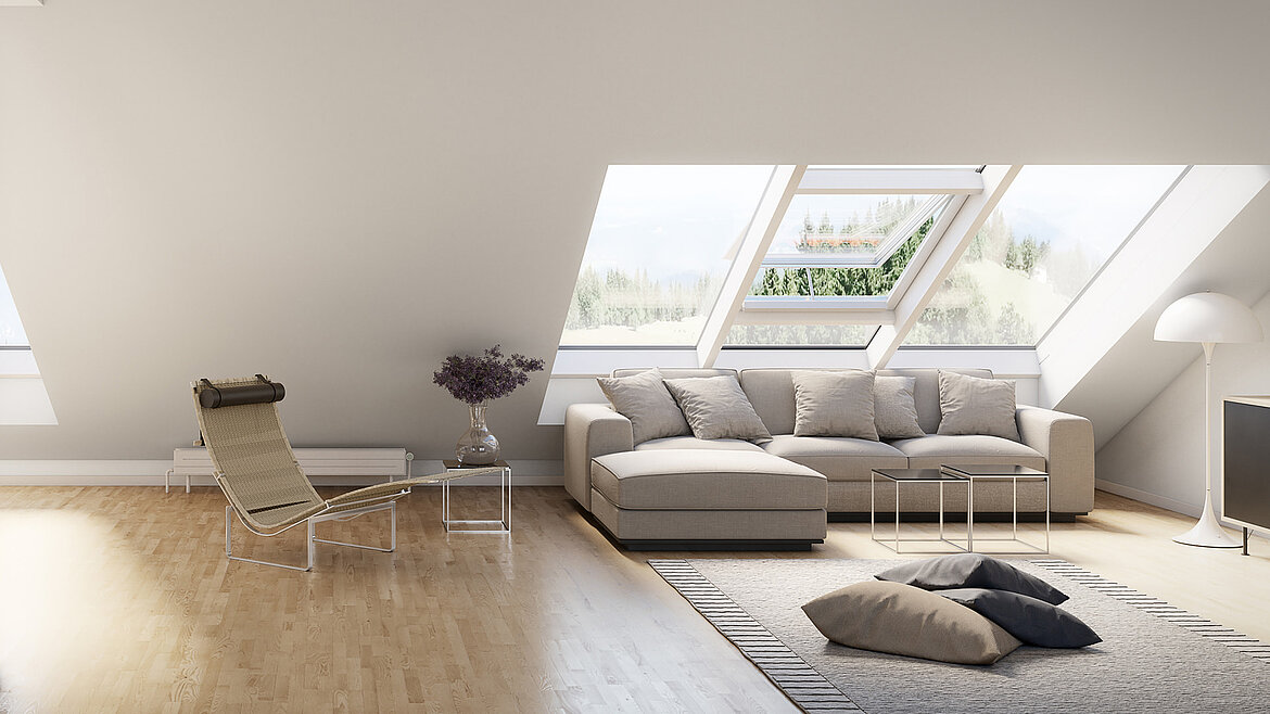 Bright attic living room with large sofa and open roof window.