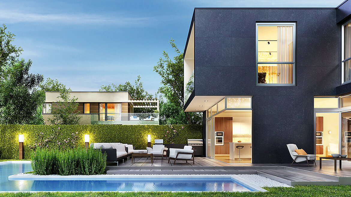 Luxury modular residential building with terrace and pool at dusk