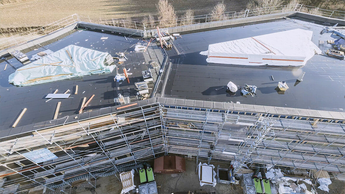 Construction site with LAMILUX PR60 glass roofs on the CADFEM office building