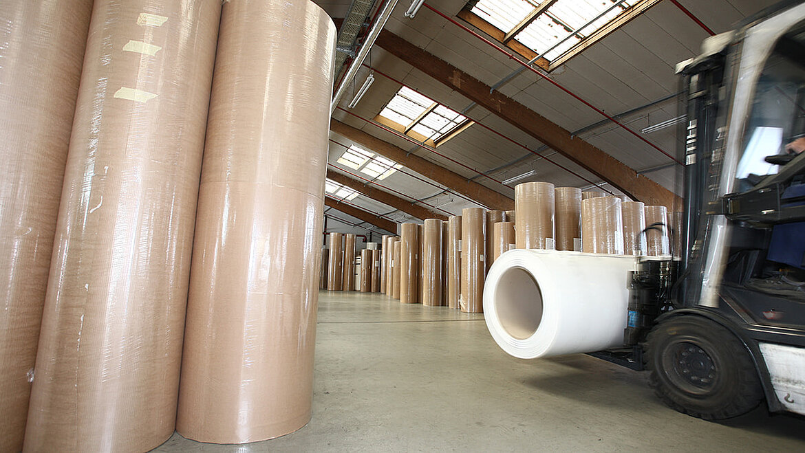 Forklift truck drives into warehouse with plastic rollers