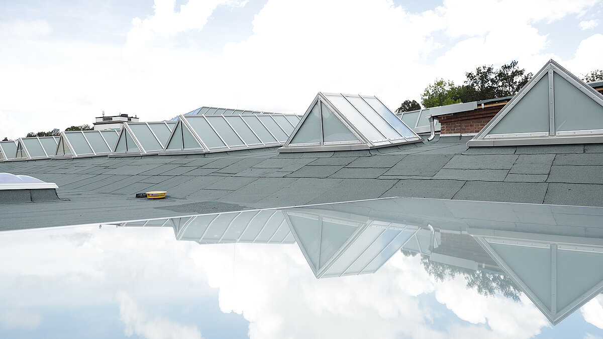 Chemnitz Tram Museum with Glass Roof PR60 in continuous shed roof configuration, modern roof glazing on the historic hall roof