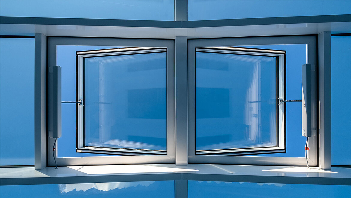 Modern glass façade with tilt-and-turn windows