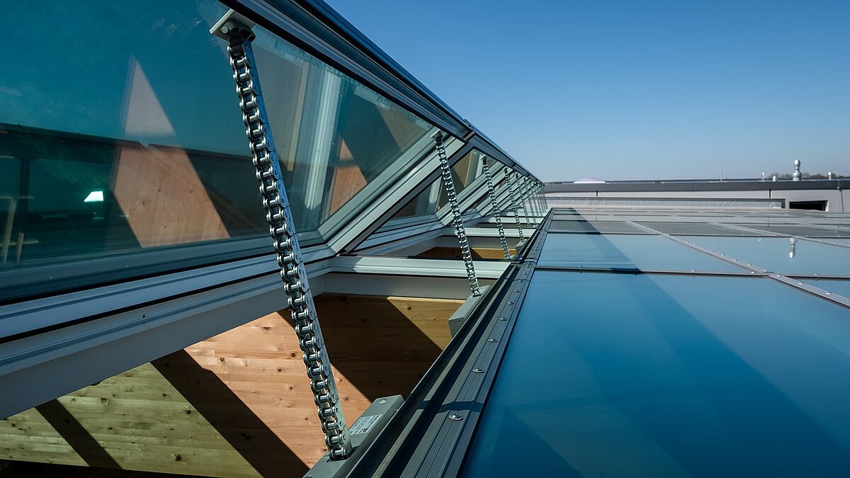 Open glass skylights with chain drive at the Byodo organic food store in Mühldorf.