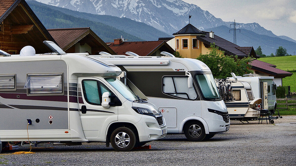 Caravan in front of mountain panorama