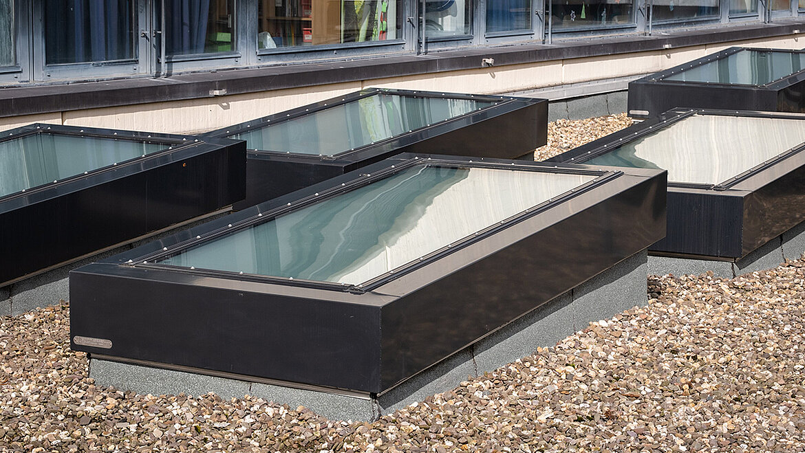 LAMILUX Glass Skylight Fire Resistance REI 30 with flush glazing on gravel roof