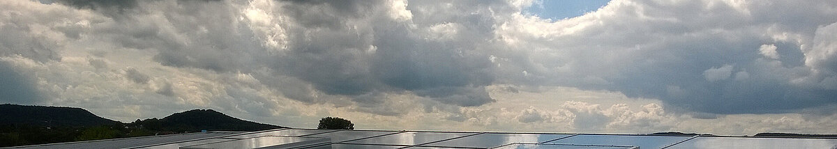 LAMILUX glass roofs on Willibald-Gluck-Gymnasium in Neumarkt under a cloudy sky.