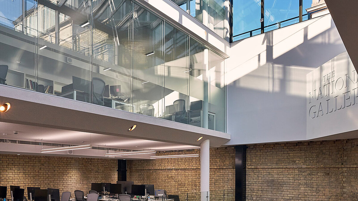 Glass roof with steel structure and large window front in modern interior