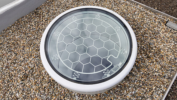 Psychiatry Emmendingen featuring LAMILUX Glass Skylight F100 Circular on a gravel roof for natural daylight illumination