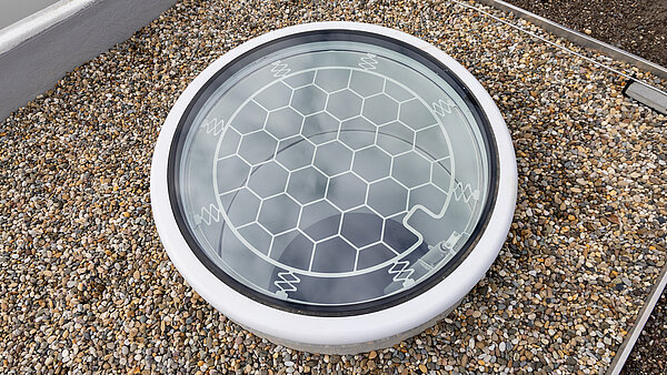 Psychiatry Emmendingen featuring LAMILUX Glass Skylight F100 Circular on a gravel roof for natural daylight illumination
