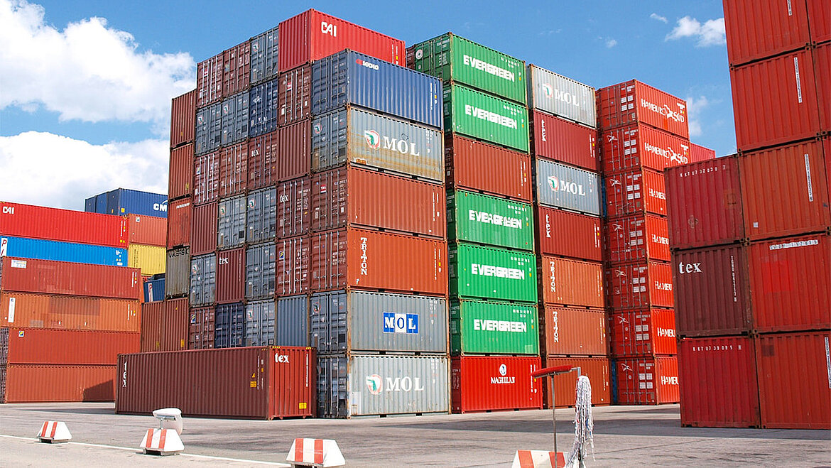 Stacked freight containers in a port container yard