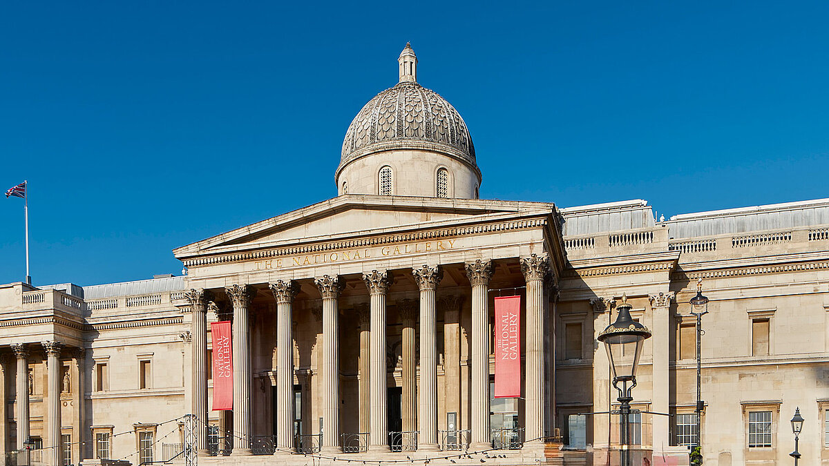 Historic building with large dome and columns under blue sky