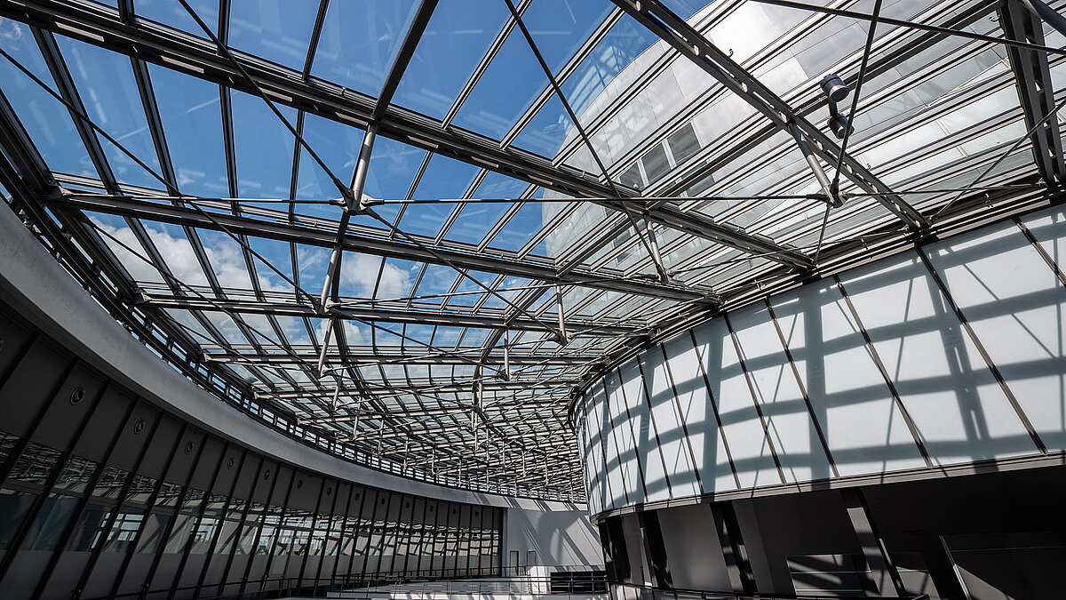 Glass roof structure at BMW Group FIZ with modern steel beams.