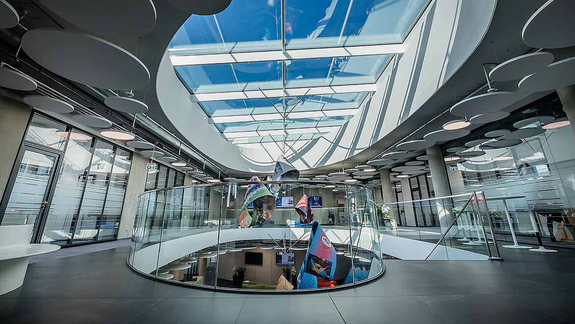 Modern atrium with oval glass roof and plenty of natural light