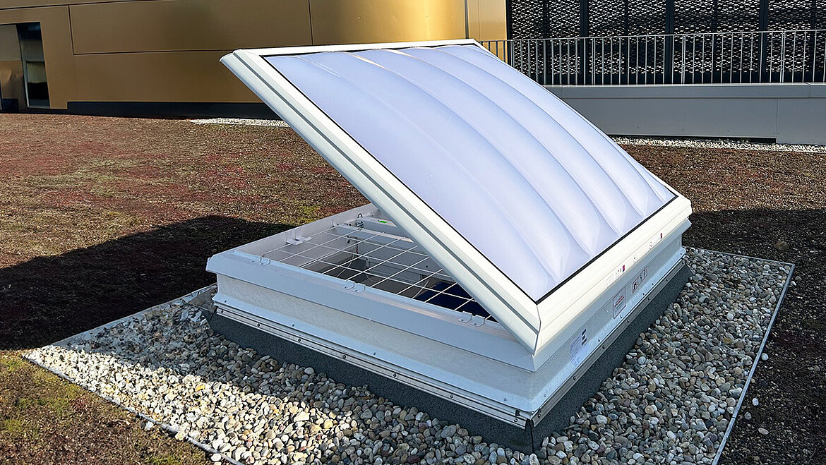 LAMILUX Rooflight F100 W with open sash on flat roof