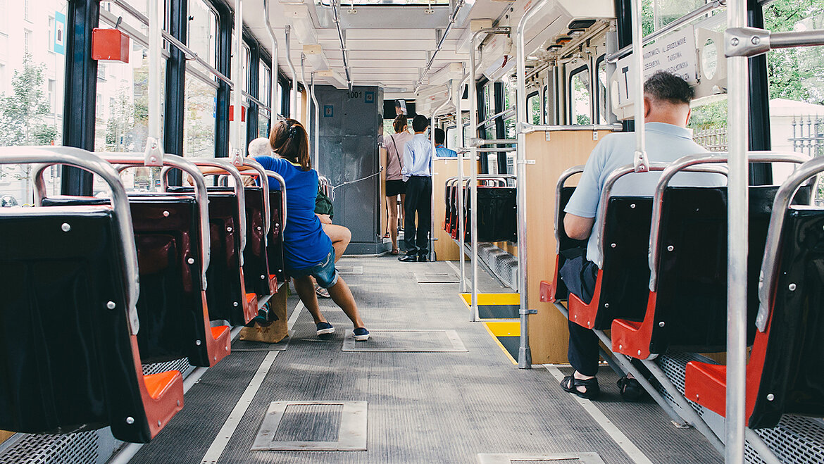 A floor panel is a part of the floor construction and is essential for the stability of the vehicle. People sitting and standing on the bus | insights by LAMILUX