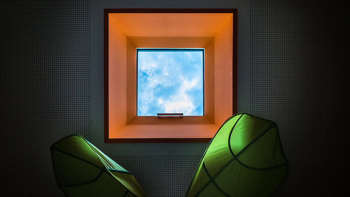View to the sky through the colourful flat roof window Child-friendly colourful flat roof window in the nursery Cloud 10 | insights by LAMILUX