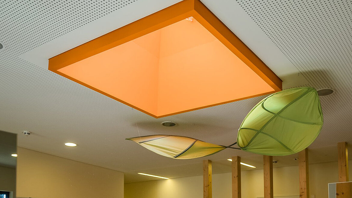 Colourful upstand of the flat roof window FE in the nursery Cloud 10 Interior design with daylight systems from LAMILUX in day-care centres | insights by LAMILUX