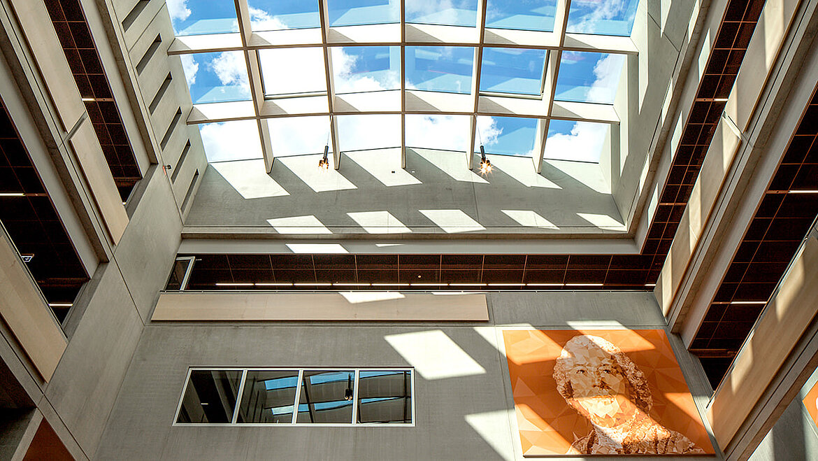 Glass roof in passive house standard over school assembly hall Open sky in the atrium of the Willibald Gluck High School | insights by LAMILUX