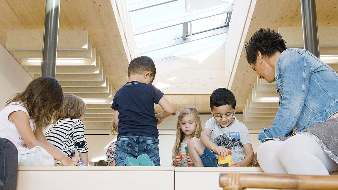 Children playing under glass roof Multifunctional room with daylight in nursery | insights by LAMILUX