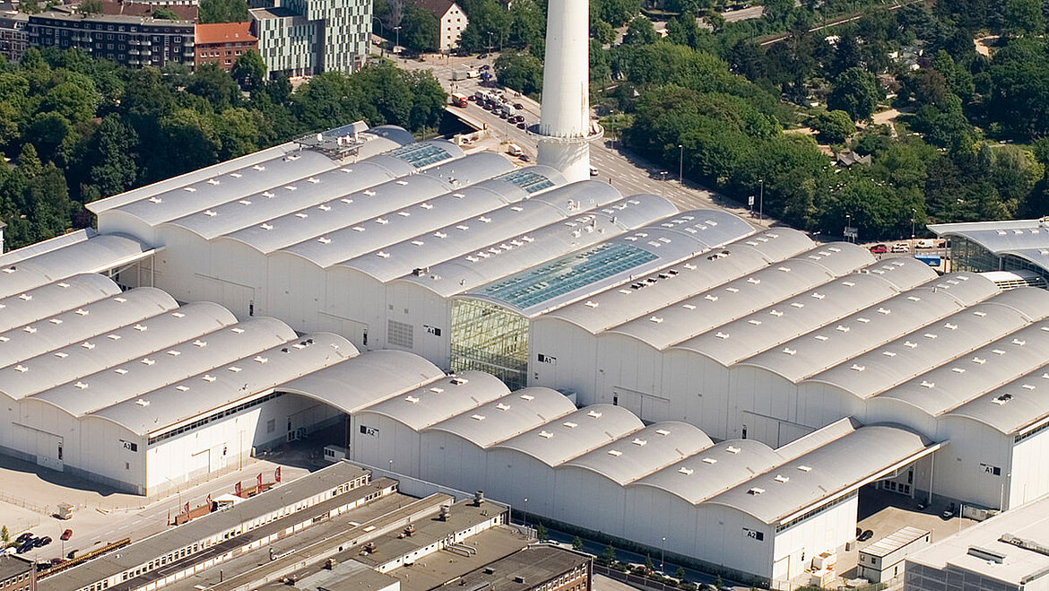 Aerial view of the New Hamburg Trade Fair Centre Drone photo of the New Hambrug Exhibition Centre with a view of the glass roof and SHEV systems | insights by LAMILUX