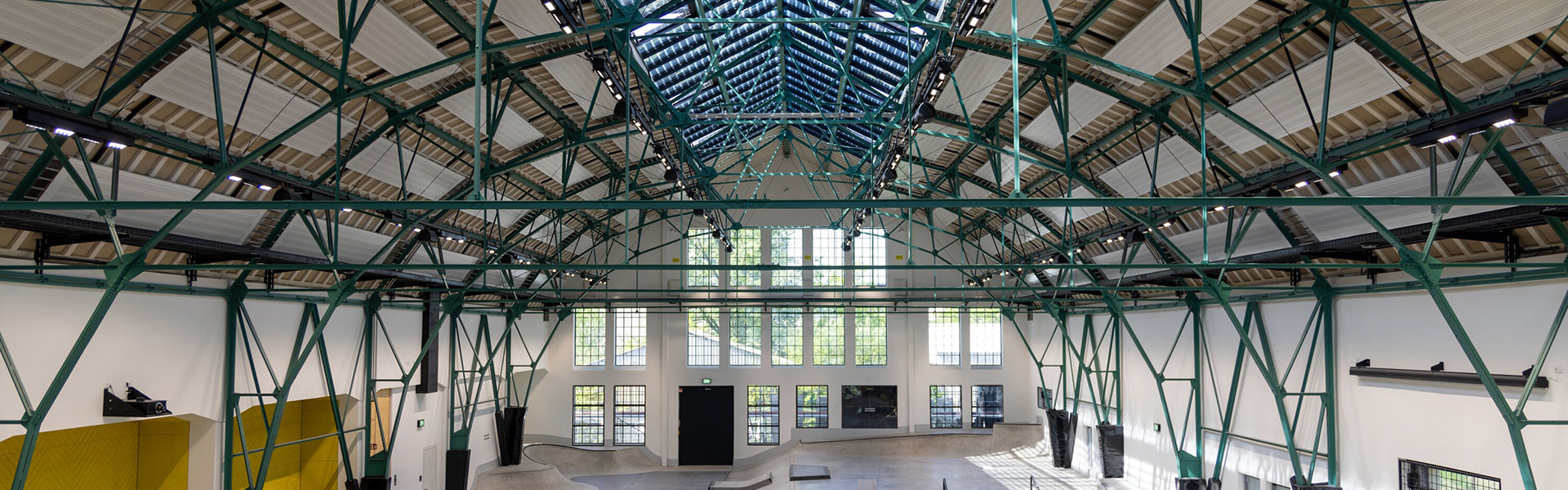 Large industrial hall with steel construction and skate park inside