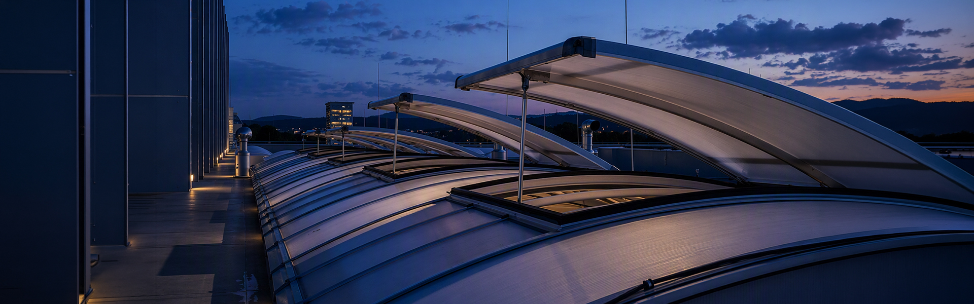 An open skylight on a flat roof at dusk